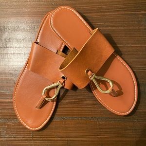 NWOT Size 9 brown and gold sandals.